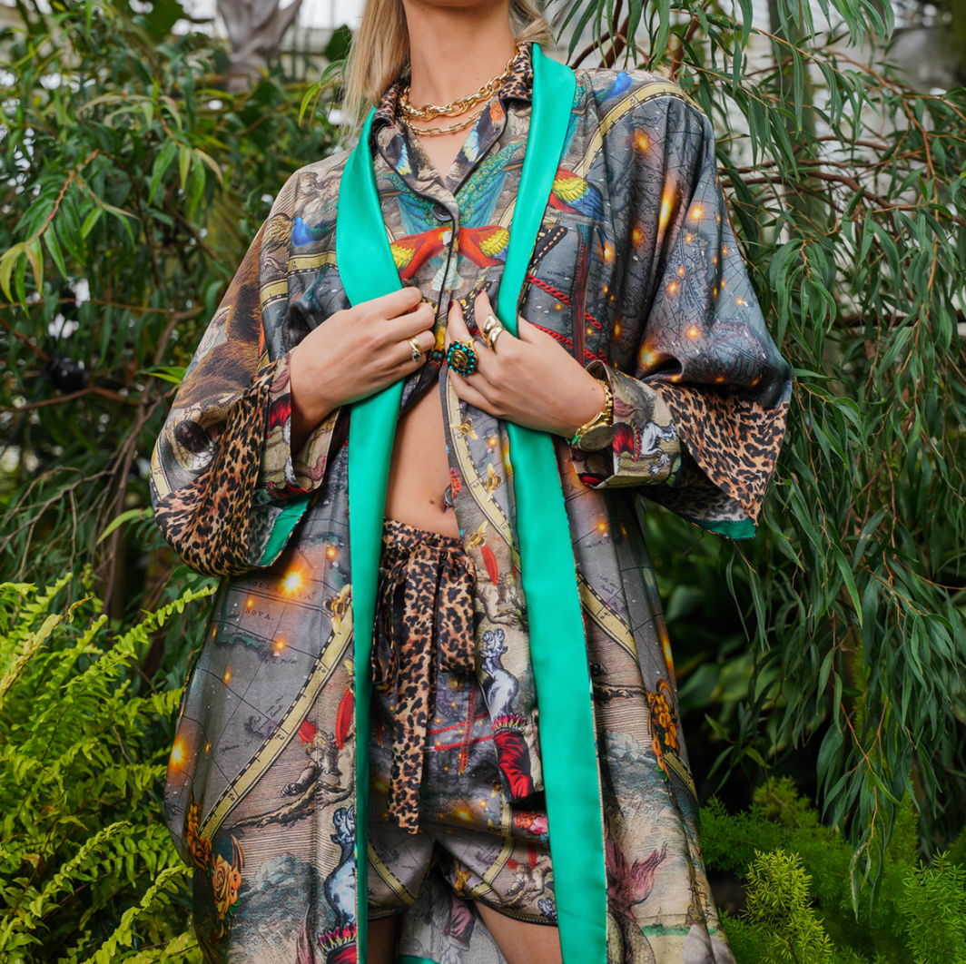 Female Model wearing luxury 100% silk Kimono with matching pyjama shorts in a maximalist tropical inspired design combined with Le Cirque Du Monde print