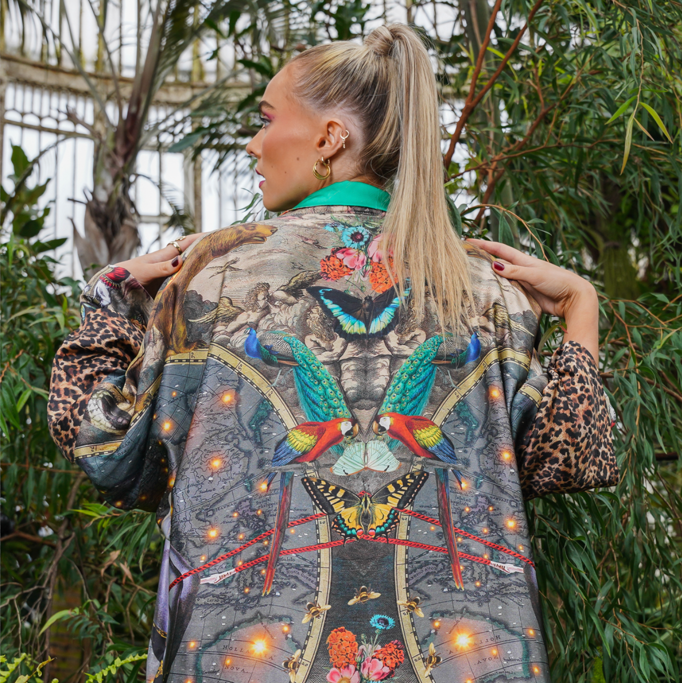 Female Model showing back view of  luxury 100% silk Kimono in a maximalist tropical inspired design combined with Le Cirque Du Monde print