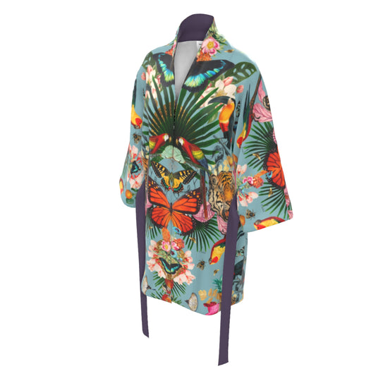 A luxury 100% silk Kimono in a maximalist tropical inspired design against a vintage blue background called - Paradise Lost Epoque