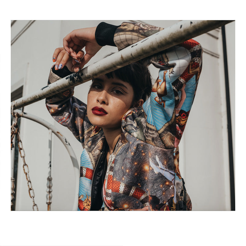 Female model wearing luxury softshell bomber jacket in a maximalist Circus inspired design