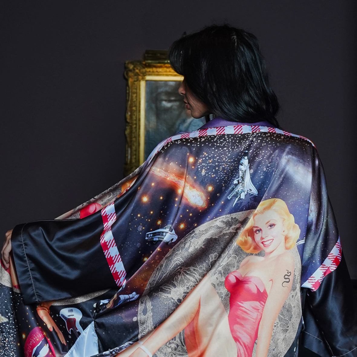 A female model showing the back view of a luxury 100% silk kimono in a maximalist retro Pin Up design