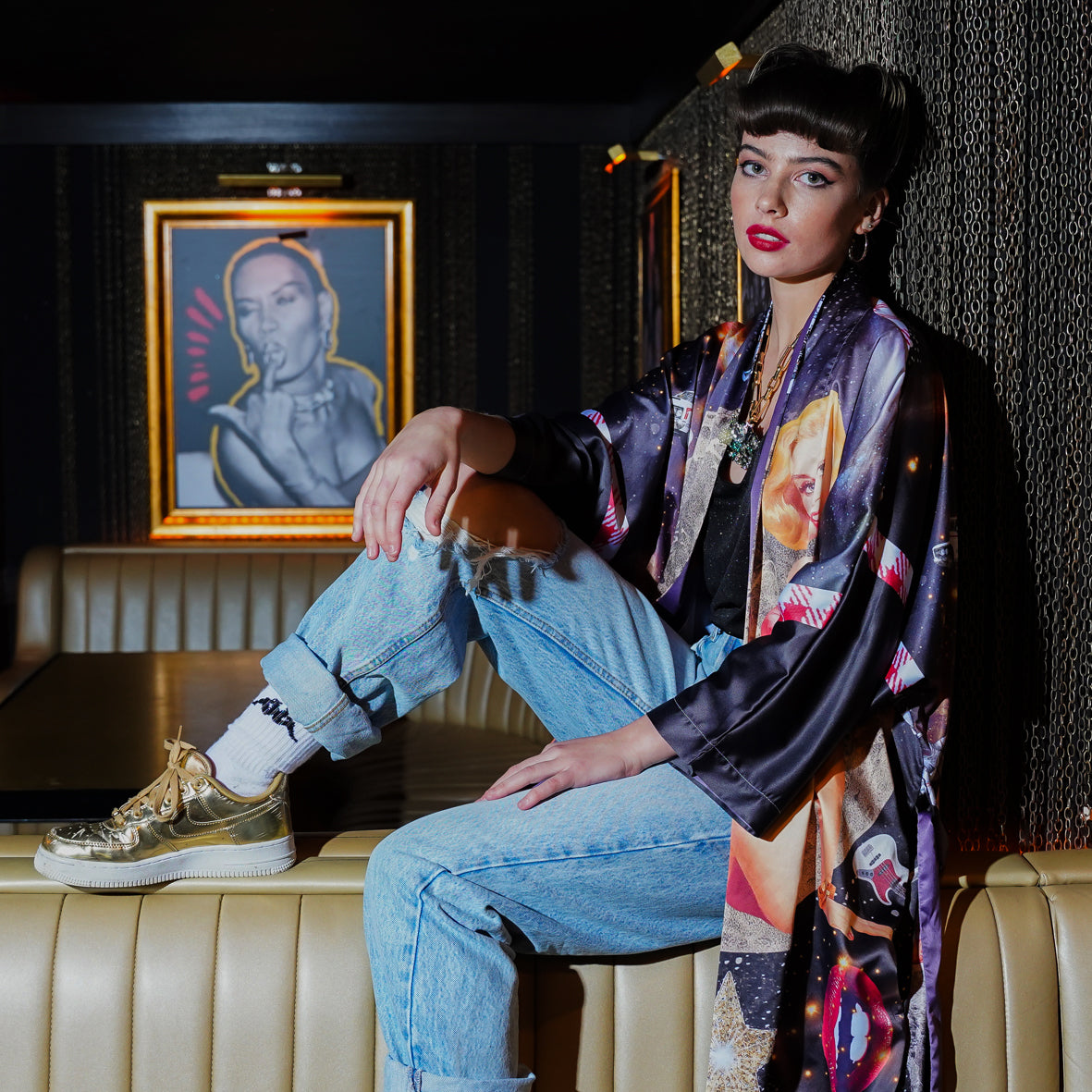 A female model in a Bar wearing a luxury 100% silk kimono in a maximalist retro Pin Up design 