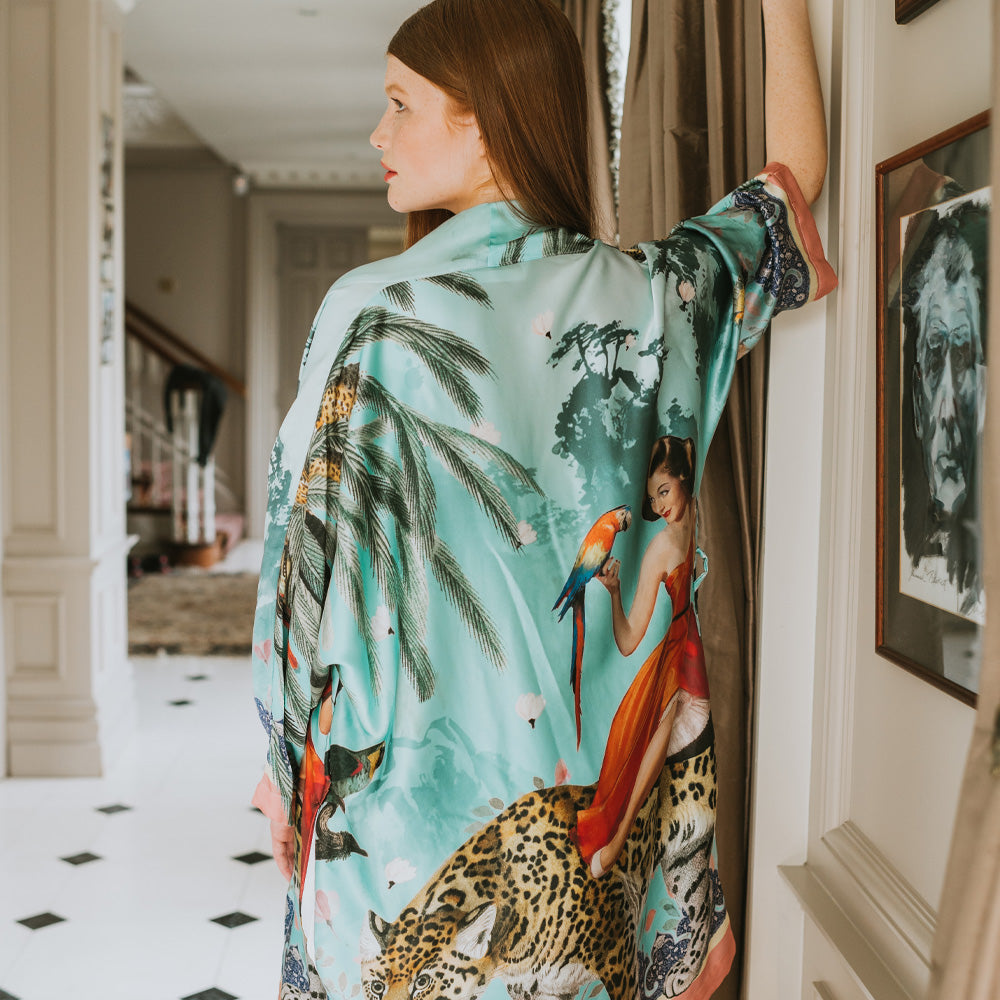 Female model showing back view of luxury 100% silk Kimono in a maximalist vintage turquoise design 