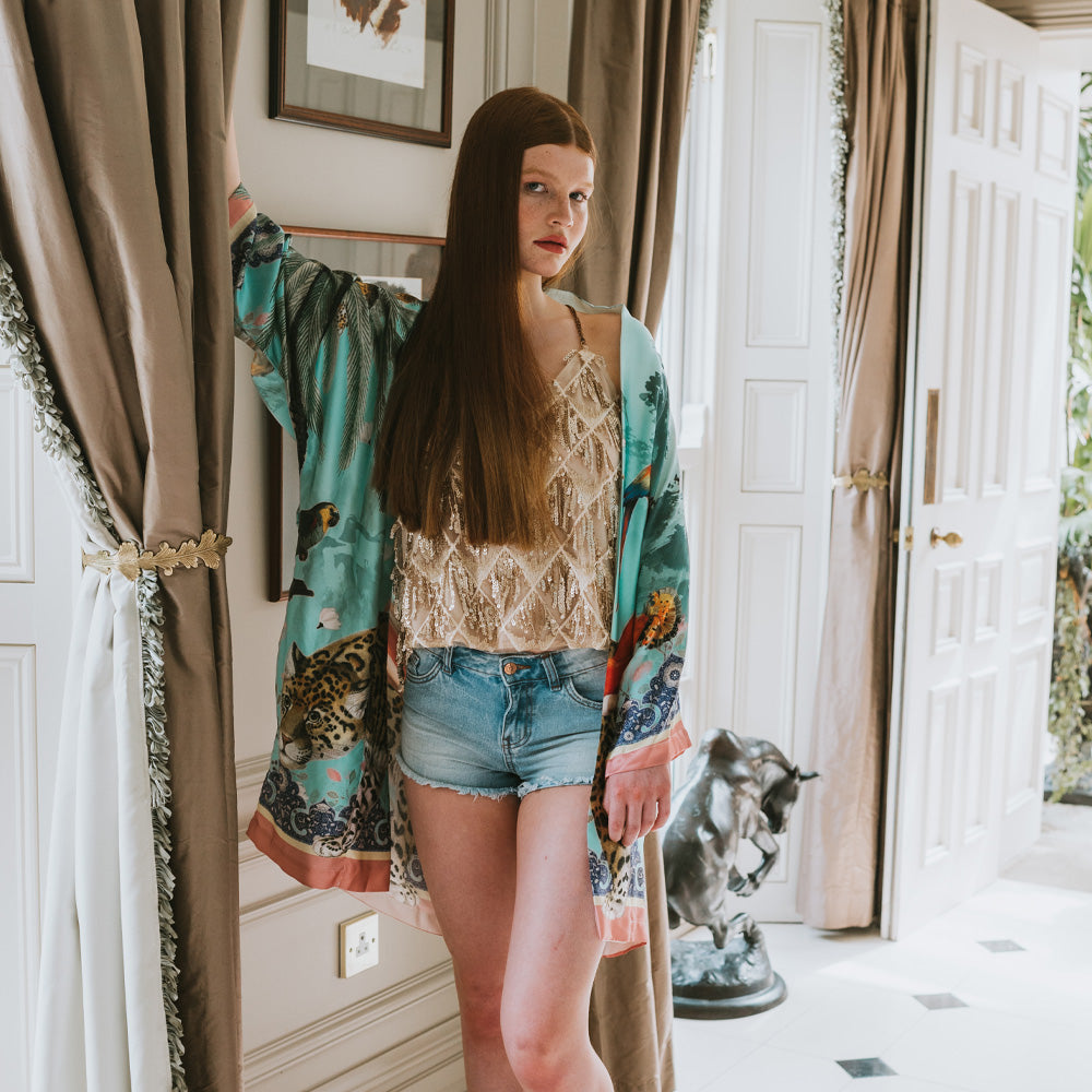 Female model wearing luxury 100% silk Kimono in a maximalist vintage turquoise design